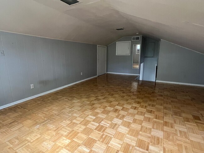 Building Photo - Spacious layout with loft style bedroom up...
