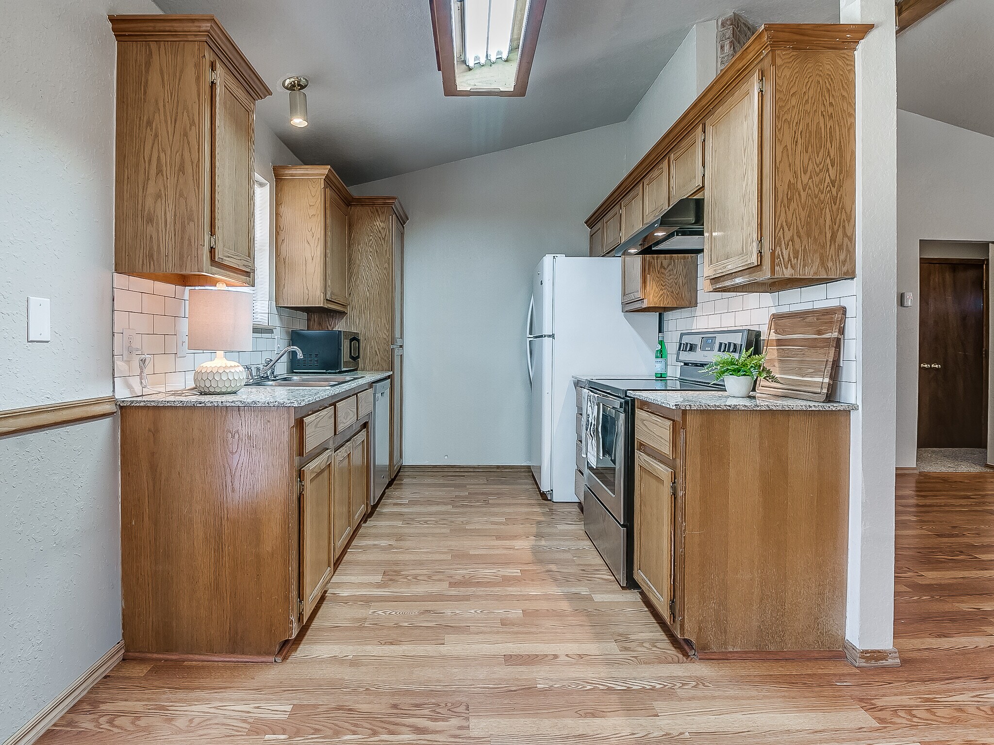 Galley kitchen with granite countertops - 1821 Overland Trail