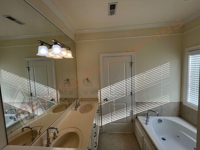 Building Photo - Elegant 3 Story 3 Bedroom Formal Model Tow...