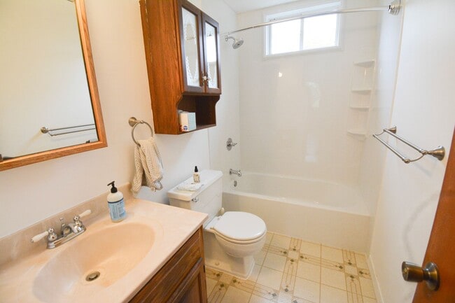 Building Photo - Beautiful multi-level with Gorgeous Yard and LOTS of Storage!