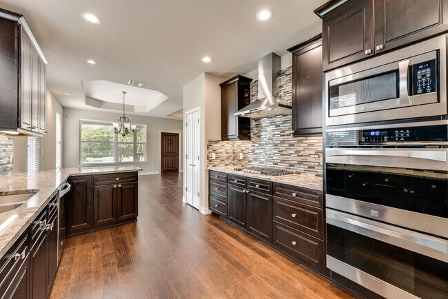 Building Photo - AVAILABLE NOW 4 BEDROOM 2.5 BATH HOME IN A...
