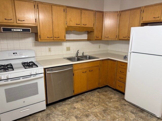 Like unit. Unit available has white kitchen cabinets. - 1118 E Washington St