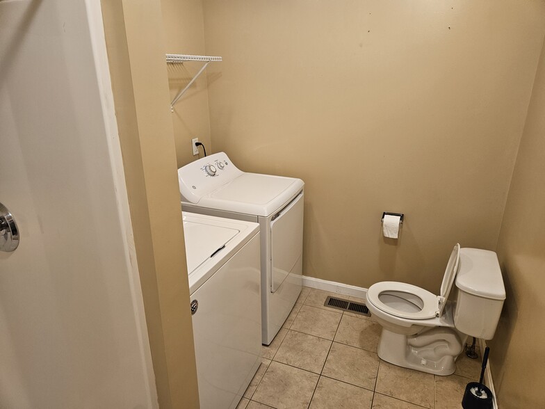 Second floor bathroom off living room with washer/dryer and walk-in shower. - 27 Route 103