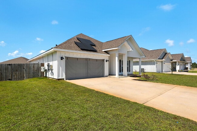 Building Photo - "Charming 4-Bed Oasis with Granite Touches in Gulf Breeze – Electricity Included   !"