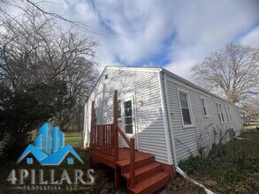 Building Photo - Charming 2 Bedroom Duplex in La Porte with Spacious Layout and Prime Location