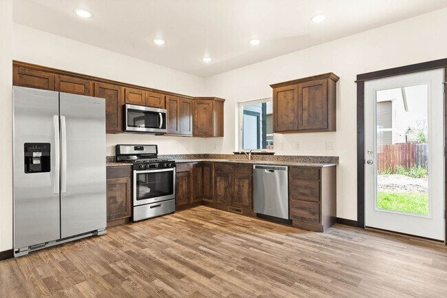 Building Photo - 2-Story Urban Triplex at a modern communit...