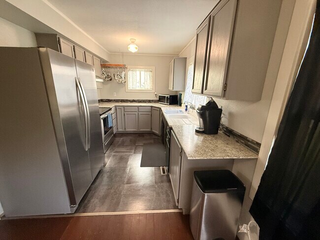 Large kitchen with stainless steel appliances - 215 N Emmett Ave