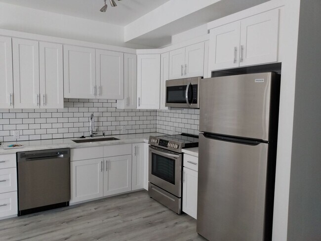 Building Photo - Your Perfect 1-Bedroom: ADA Friendly, Hardwood, Granite Counters