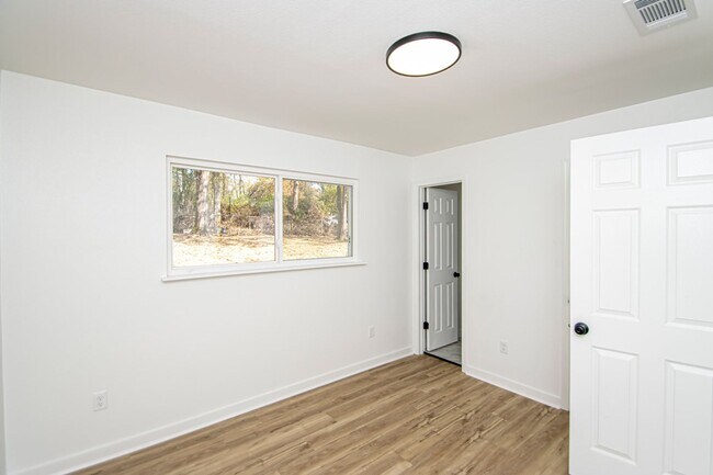 Building Photo - Large Open-Concept 4 Bedroom with Stunning Pond Views!