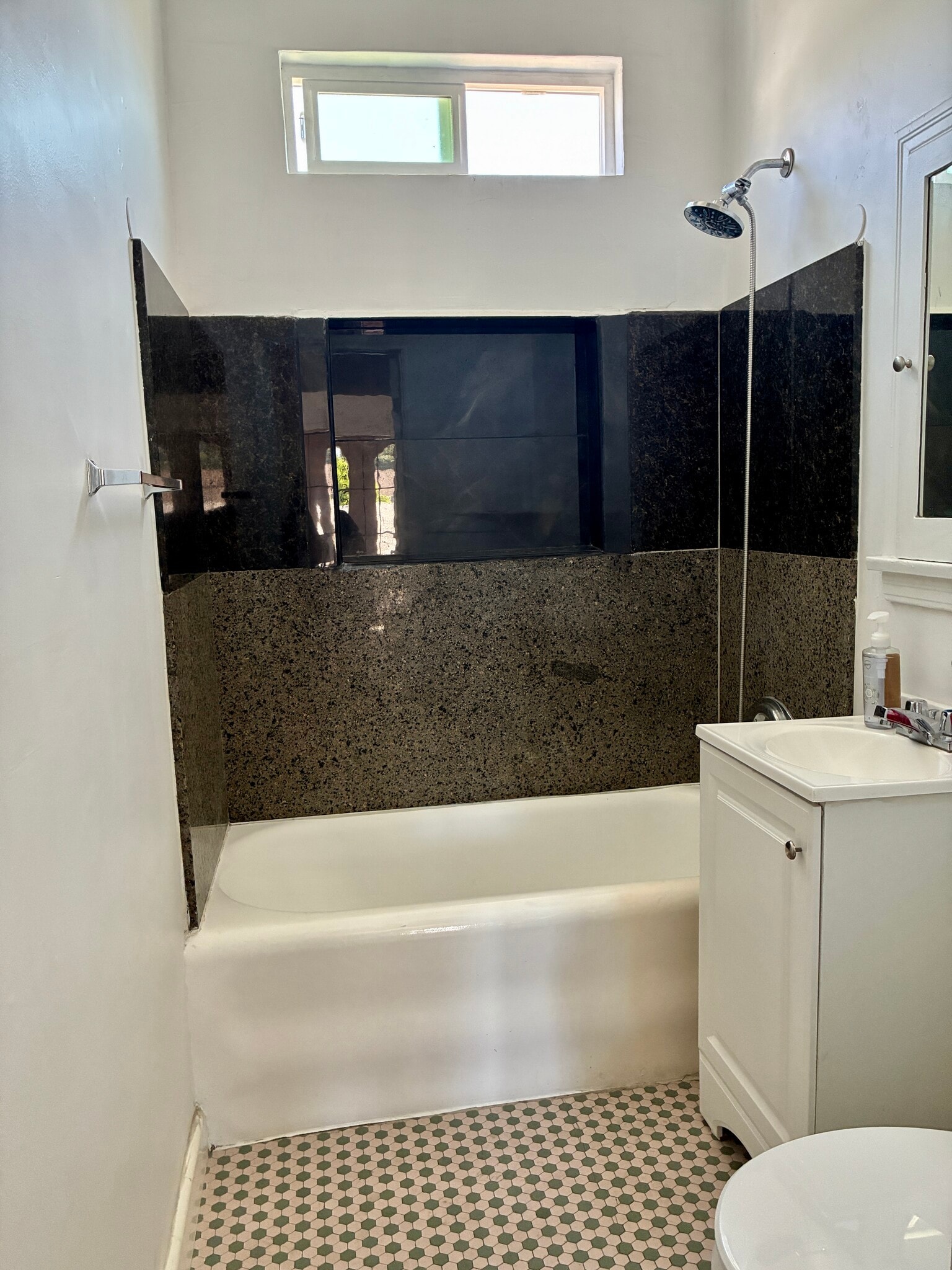 Bathroom: granite shower walls - 1046 Saint Louis Ave