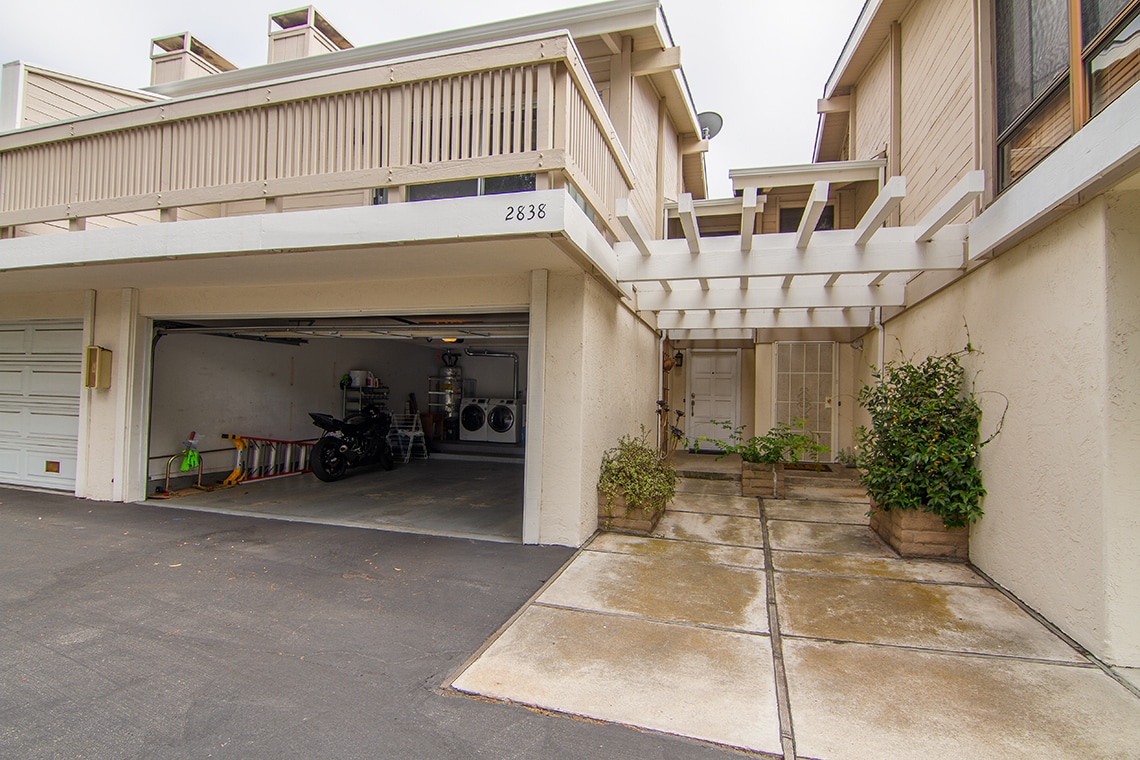 Main entrance next to attached 2 car garage. - 2838 Luciernaga St