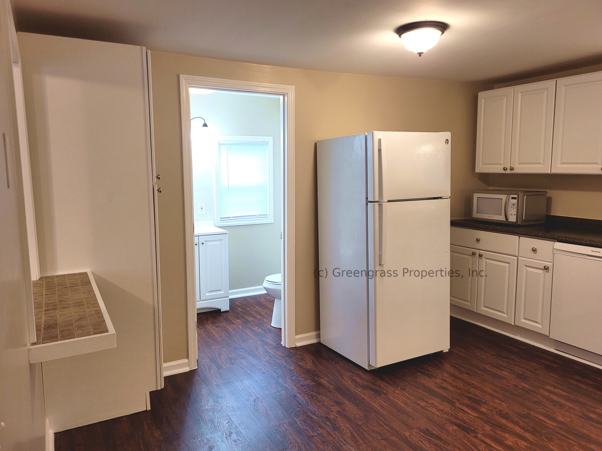 Refrigerator, Pantry, Breakfast Bar, Entrance to Full Bath - 205 S 6th St