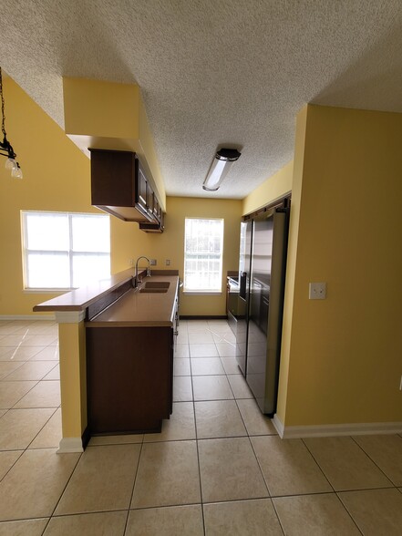 Gallary kitchen with over-sink LED lighting - 4910 Windsor Green Way