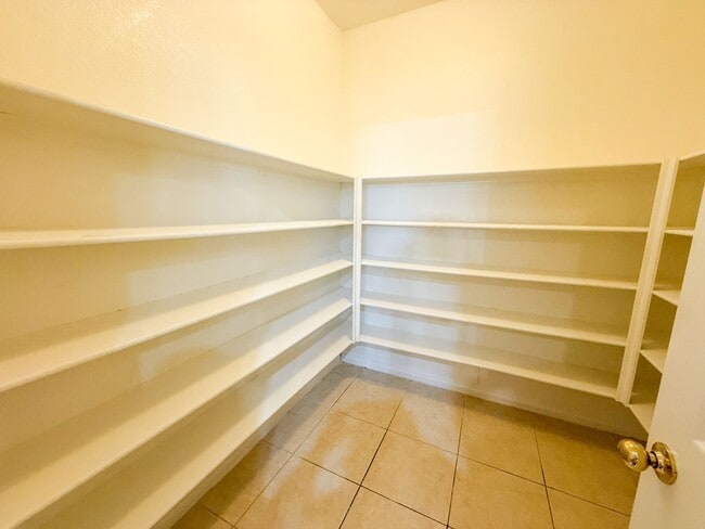 Building Photo - SPACIOUS HOME IN GATED COMMUNITY WITH POOL, RV PARKING & 4-CAR GARAGE!