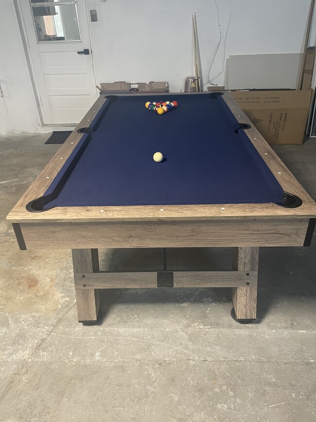 Pool table in garage. - 767 SW Ravenswood Ln