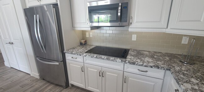 Building Photo - 4 Bedroom 3 Bathroom Upgrade Model Home