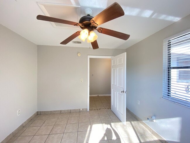 Building Photo - 2/2 home with garage - tile on inside with screened rear porch!