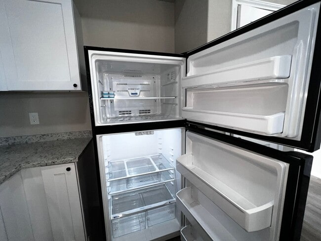 Building Photo - Modern 3BR Townhome w/ Garage, Private Yard & No Carpet – Built 2022