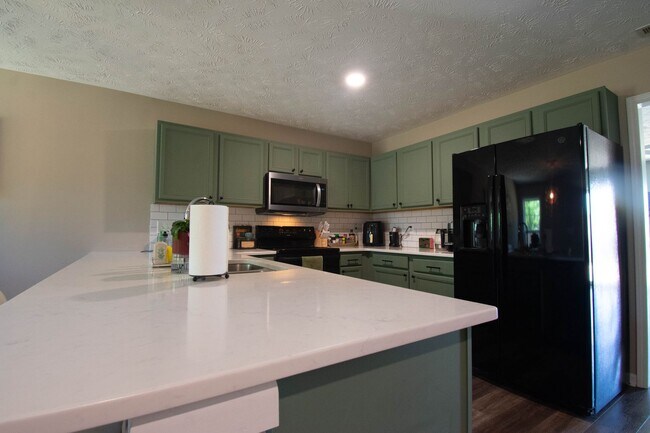 Building Photo - Coming Soon! 3 Bedroom 2.5 Bathroom with Large Fence Yard