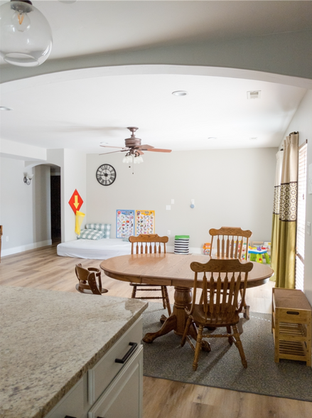 Basement living/dining area, featuring french doors that open to a patio and fenced backyard. - 14487 S Cuchara Way