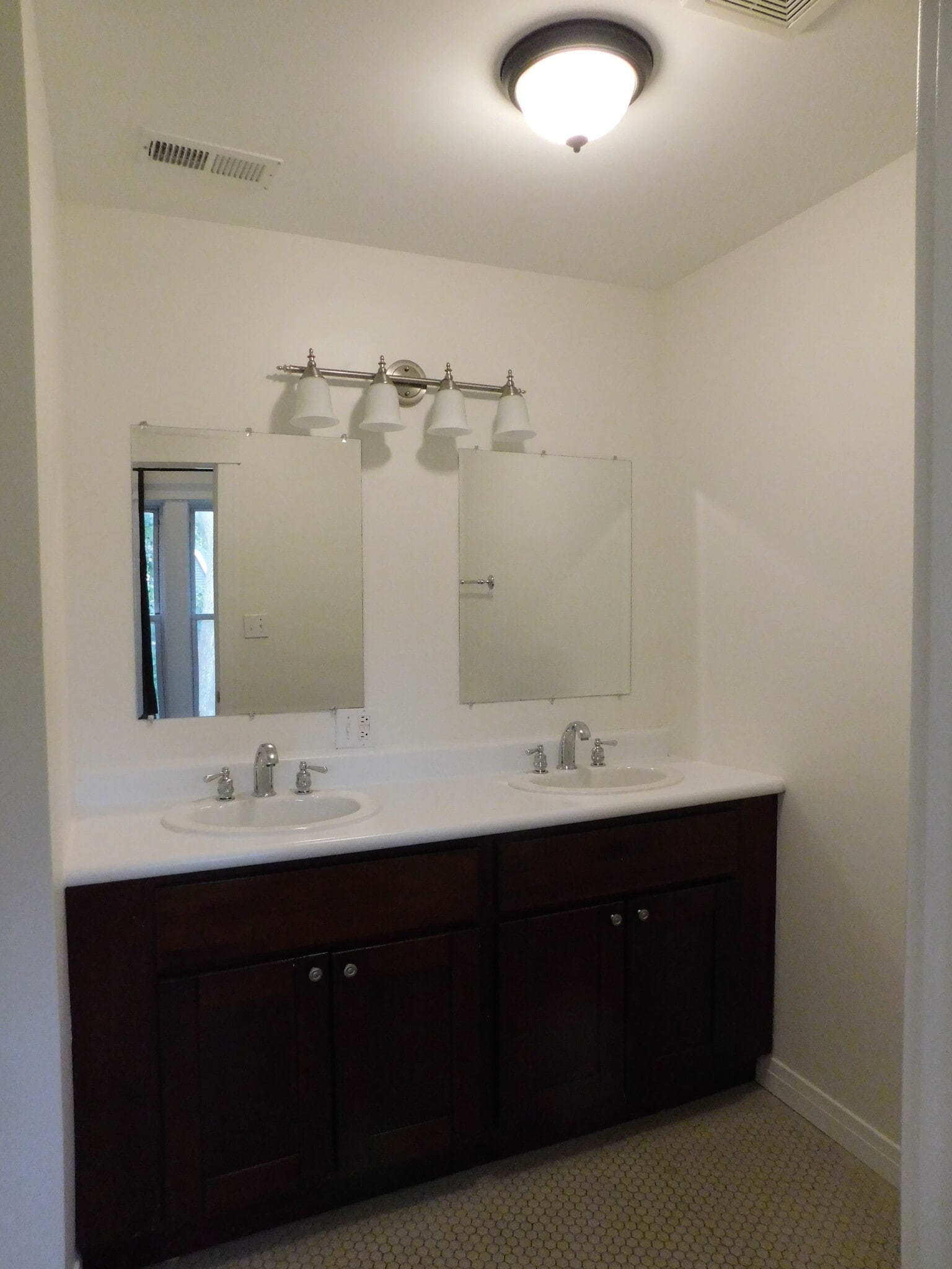 Main bathroom includes tub with shower and toilet. - 1566 Dewey Ave