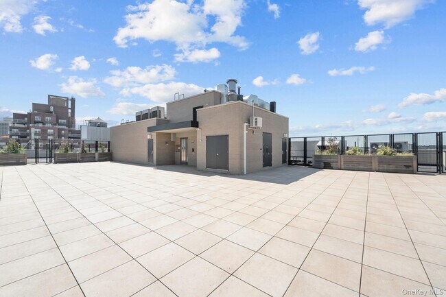 Building Photo - 107-06 Queens Blvd