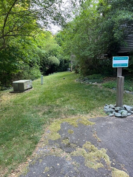 backyard from parking lot - 130 E Longview St