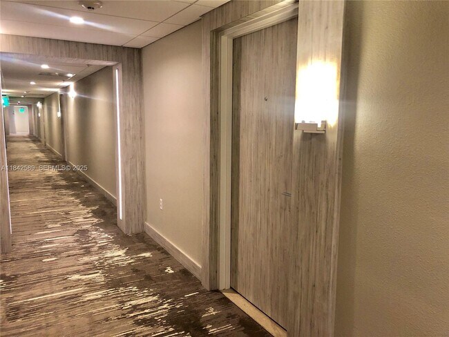 Building Photo - 10275 Collins Ave