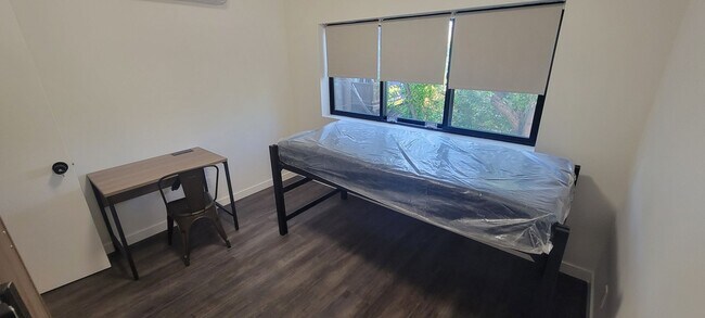 Building Photo - NEW Building, with NEW appliances, NEW flo...