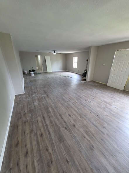 Main living area, new flooring and corner fireplace - 4701 Cherry St