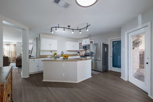 Building Photo - Patio Living with Basketball Court