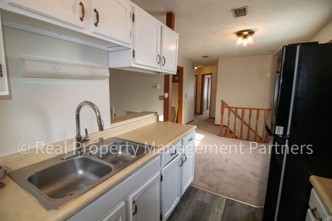 Building Photo - 2-Bed, 1-Bath Upper Unit with Garage & Porch – Steps from Paul Henry Trail