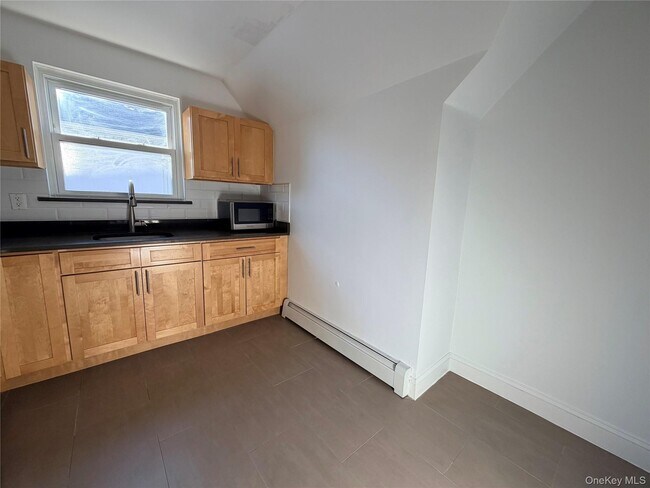 Building Photo - 210-10 56th Ave