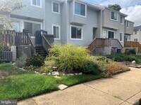 Building Photo - Beautifully updated 2 bd 1 bth patio level condo backing to open area.