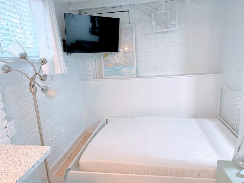 bed frame with mattress. Good under bed storage - 570 Saint Charles Ave NE