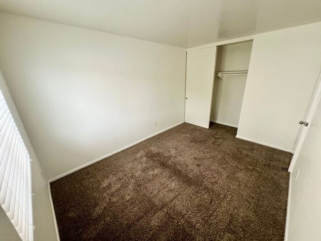 Building Photo - Stunning 4BR Townhome with Hardwood Floors, Private Patio, Community Pool & 2-Car Garage!