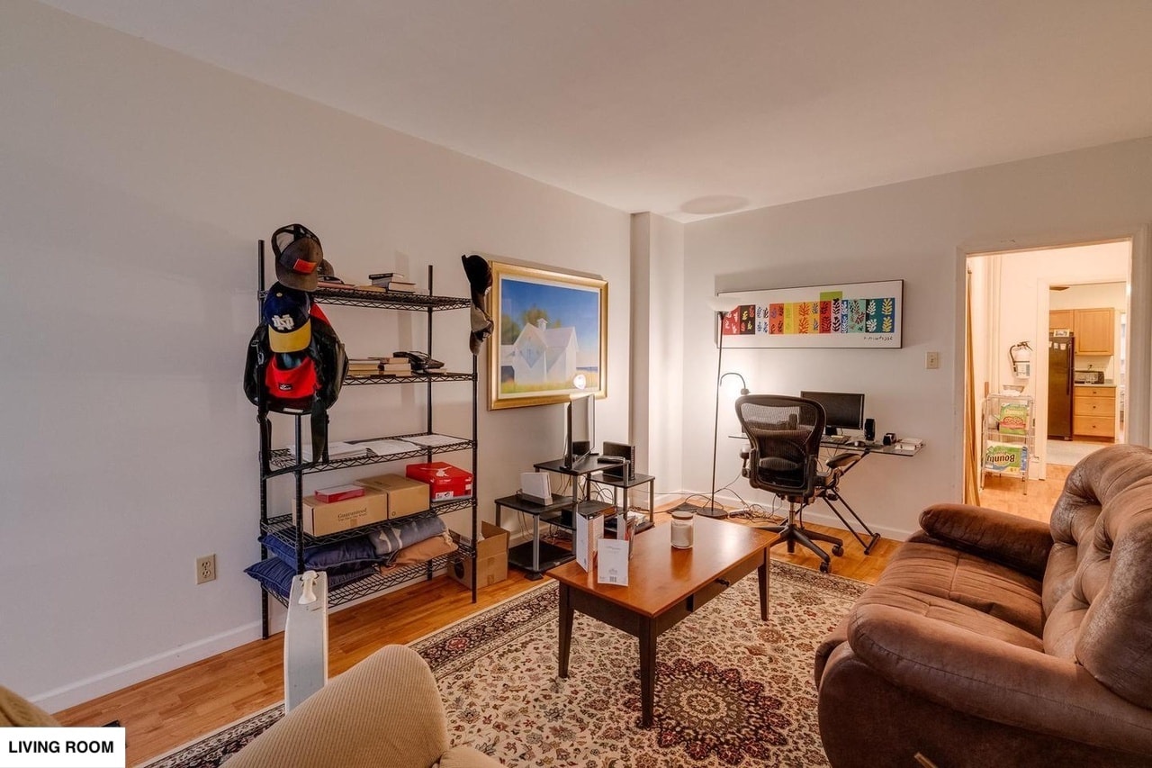 Spacious Living Room with large couches and furniture for scale. - 513 1/2 W James St