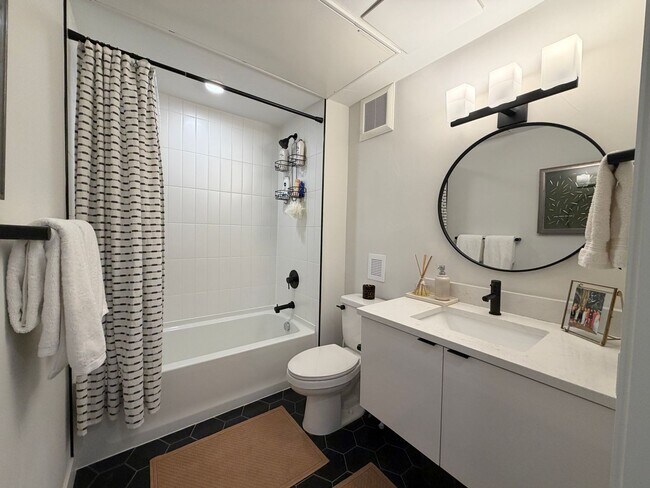 Building Photo - Top-Floor Corner Condo with Downtown Views — Stylish, Pristine, and Steps From Everything