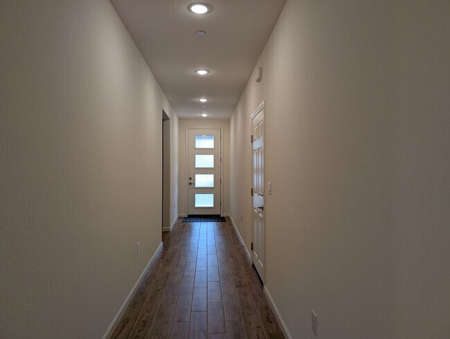 Building Photo - New Wilson home offering modern amenities, solar and a nice floor plan. Bonus room with den or of...