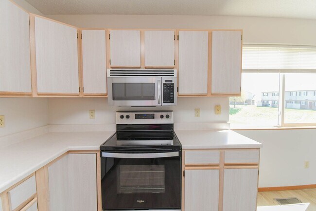 Building Photo - Updated 3BR Split-Level Home with Huge Deck, Fenced Yard & 2-Car Garage Near I-29!