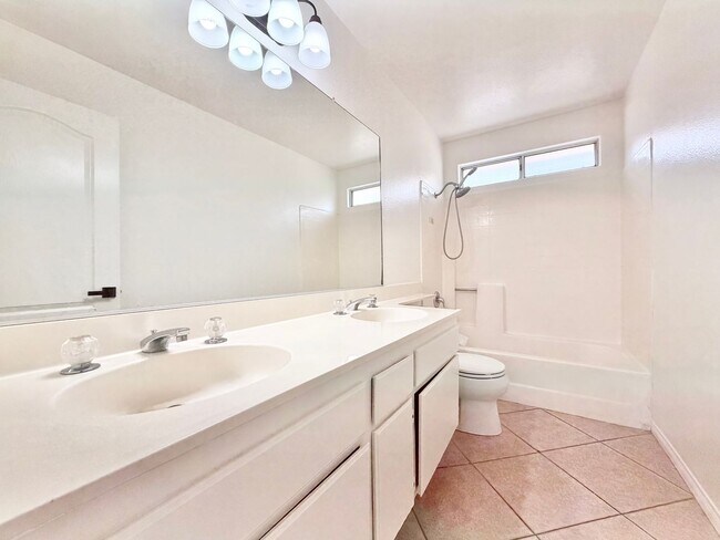 Building Photo - Spacious 5 Bedroom 3 Bathroom Home with Updated Paint, New Roof & Private Balcony