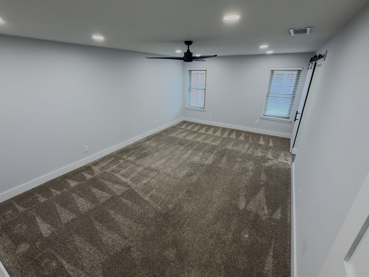 Main bedroom with ceiling fan and dual windows - 2006 Candle Ct