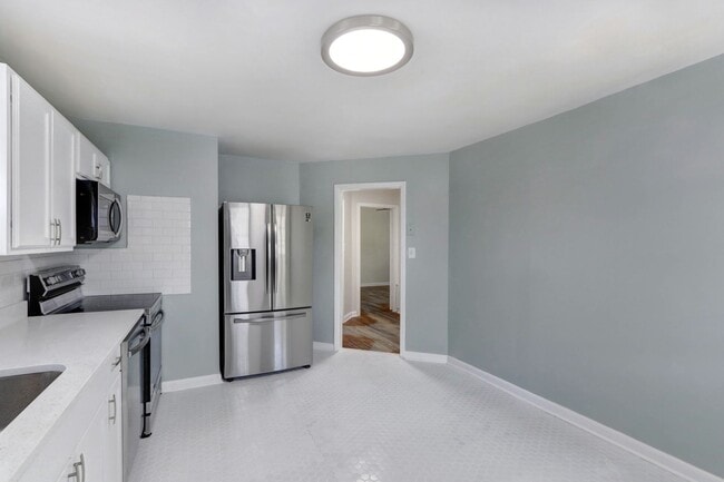 Building Photo - Renovated Three Bedroom House with large yard