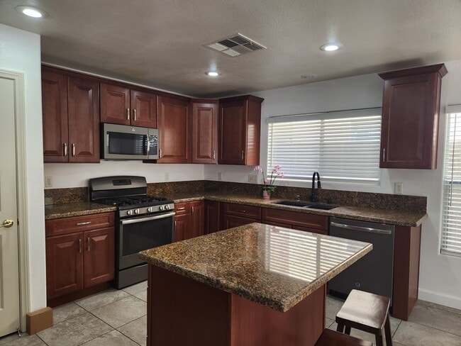 Building Photo - Sleek 2 story home with tile in most living areas and upgraded kitchen.
