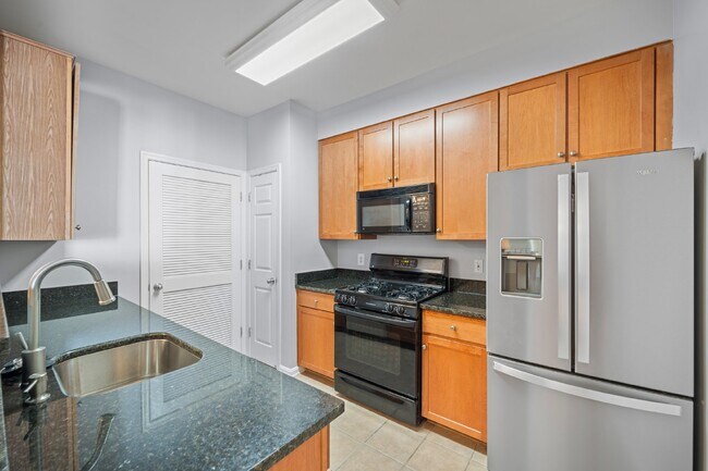 Building Photo - Two-bedroom, two-bathroom model with a den, located on the third floor.