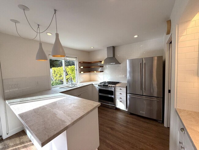 Building Photo - STUNNING THREE BEDROOM PLUS OFFICE MARINER GREEN CONDO WITH GREAT OUTDOOR SPACE