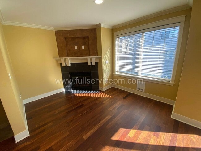 Building Photo - Spacious townhome with private backyard, garage parking, multiple decks, and a dedicated home off...