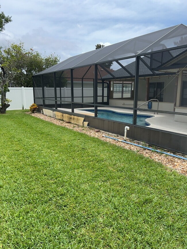 Building Photo - Spacious Pool Home in Desirable Palm Harbor – Pool Care Included