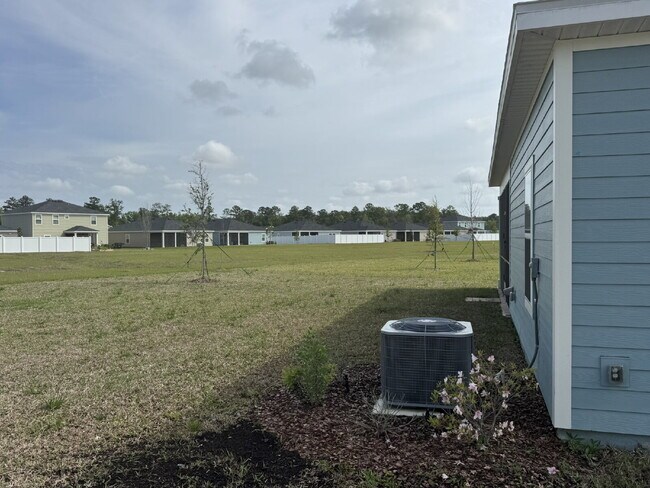 Building Photo - "Spacious 4-Bed Oasis with Granite Finishes & Guest Suite in Jacksonville!"