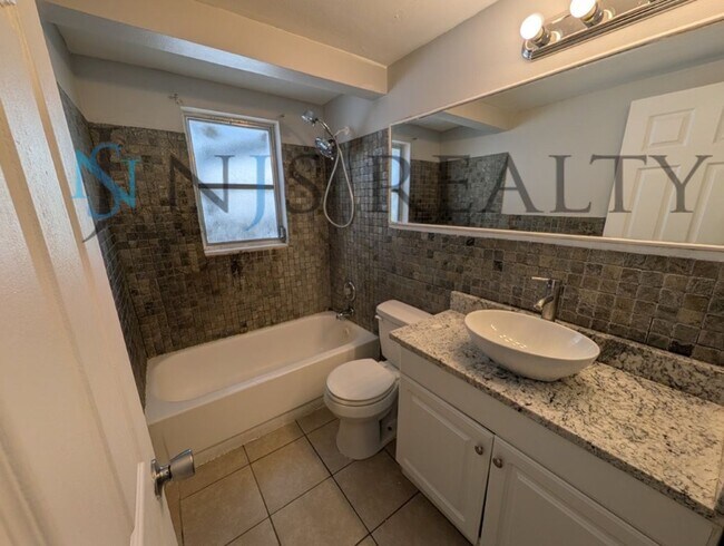 Building Photo - JUST REDUCED!!!  3/2/1 1508 Sq. Ft. LARGE Corner Lot home: Updated Kitchen & Baths, NEW paint, NE...